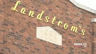 Landstrom's building sign on a brick wall, dated 1928